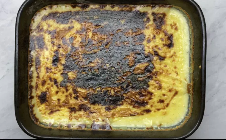 A tray of qumështor from the broiler, its top browned and charred in patches